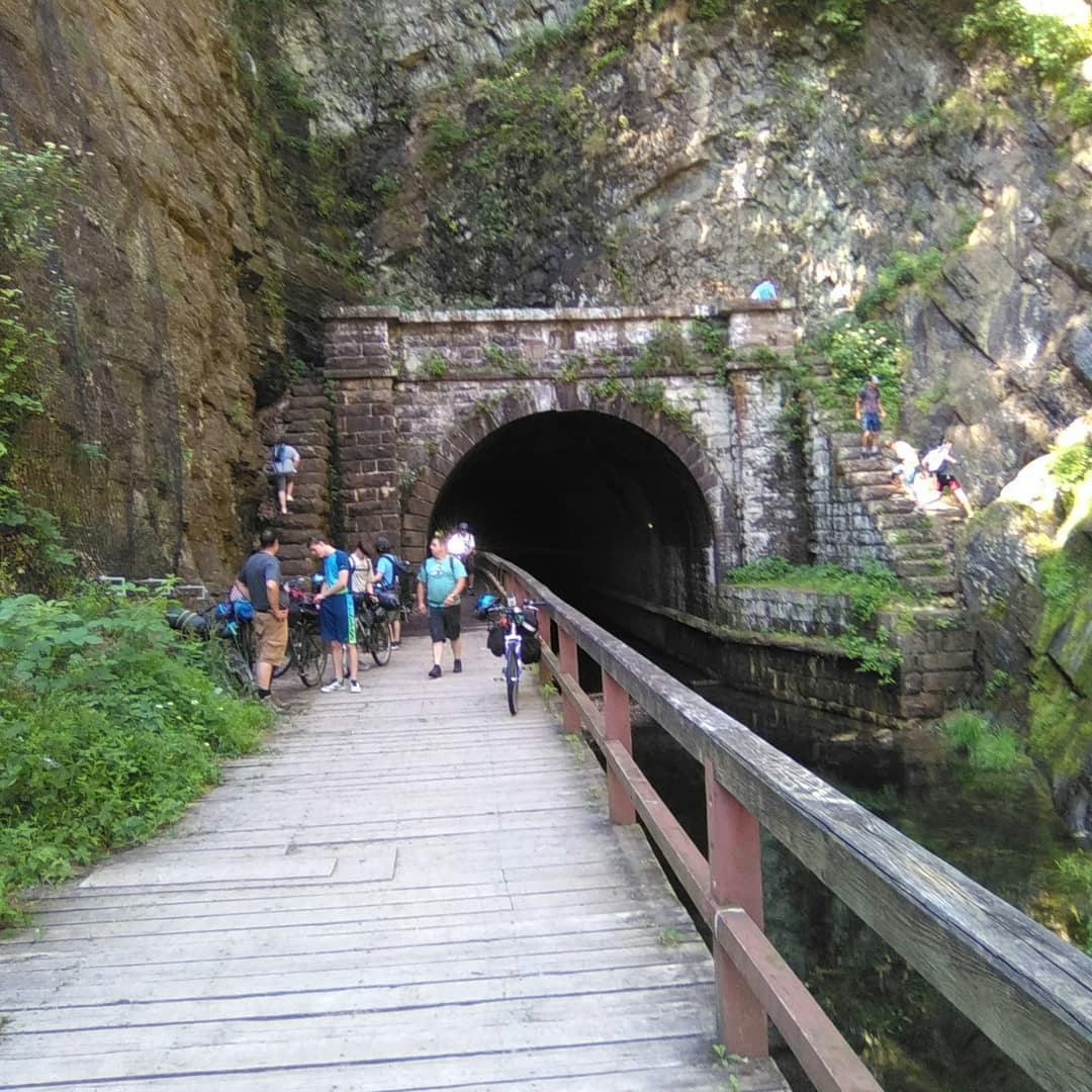 The opposite side of Paw Paw Tunnel. People are looking at the tunnel and wandering around it. 