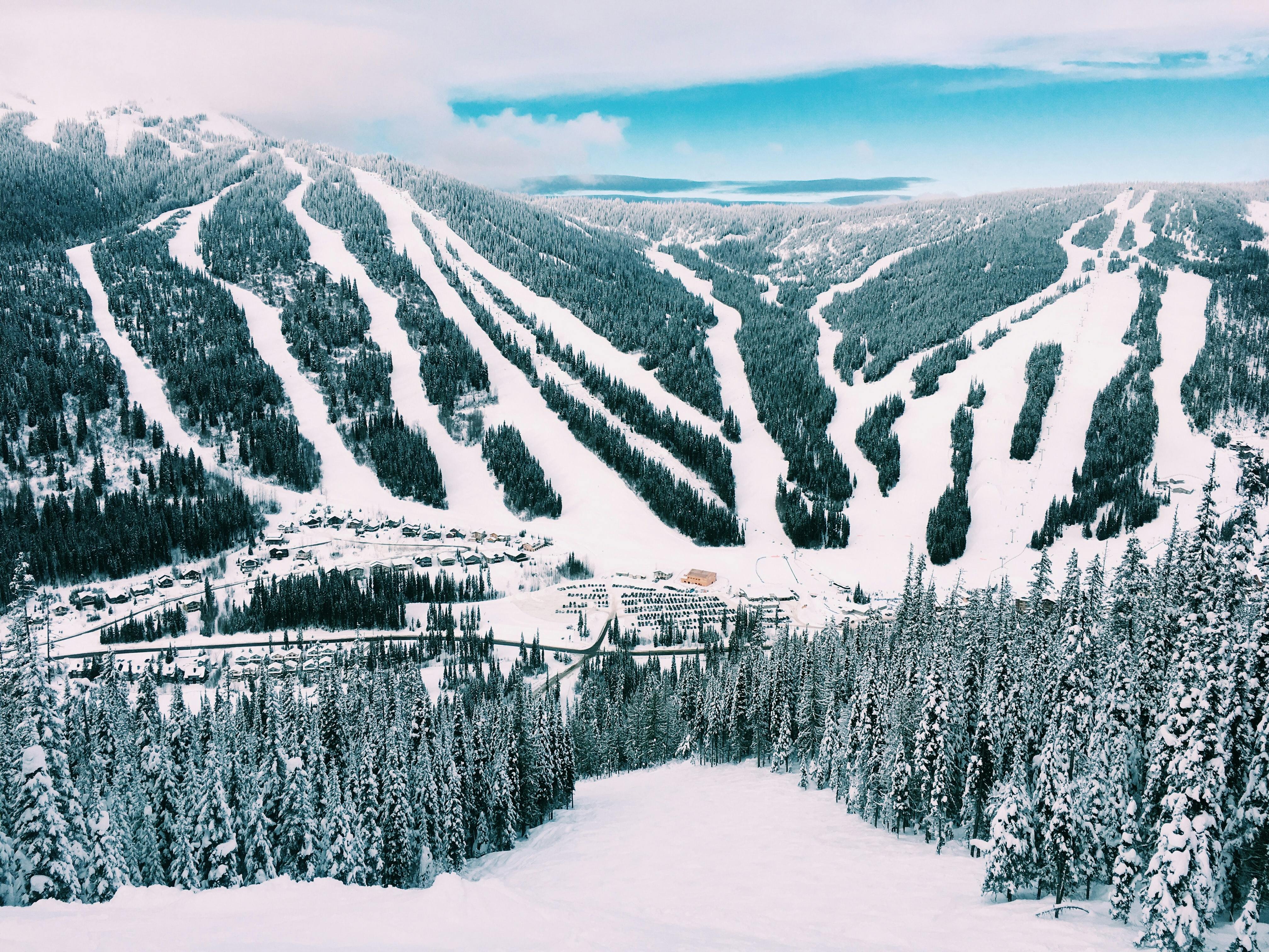 A photo looking down at a ski resort from the slopes. 