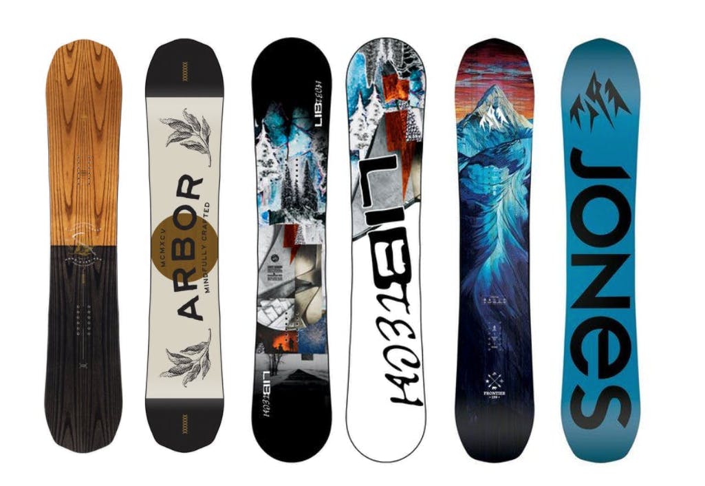 Three snowboards with photos of the top and bottom of the board. From left to right, a black and brown board, a black and tan board with a graphic of a plant, a black board with blue and white graphics, white board with word "LIBTECH", blue board with mountain scene, blue board with black lettering of the word "JONES".