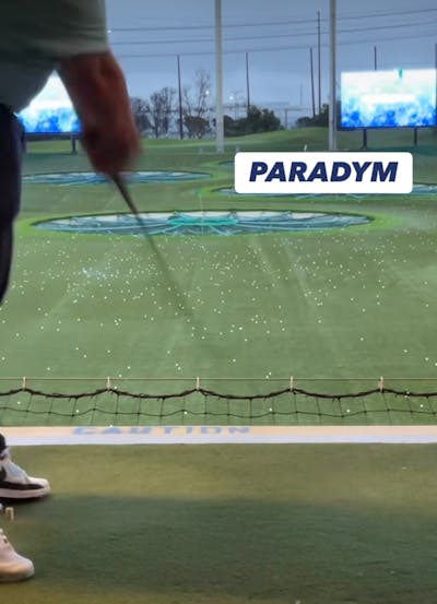A golfer swinging the Callaway Paradym X Hybrid. 