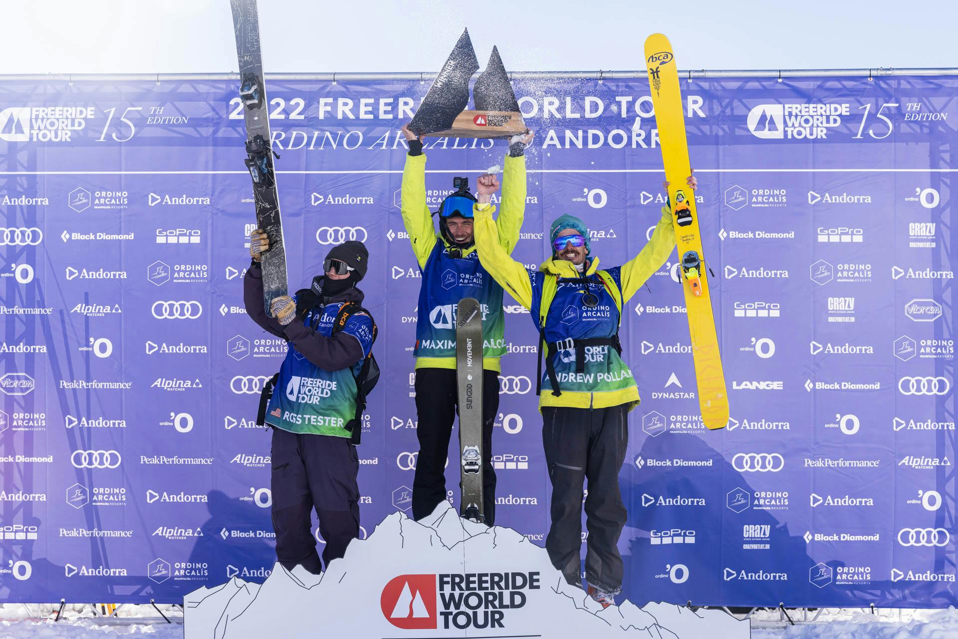 The three male winners stand on the podium and celebrate. They're backdropped by a purple FWT background.