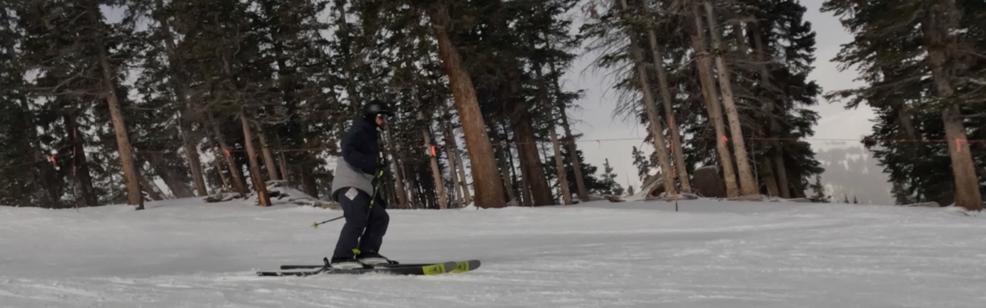 A skier on the 2023 Rossignol Sender 104 Ti Skis.