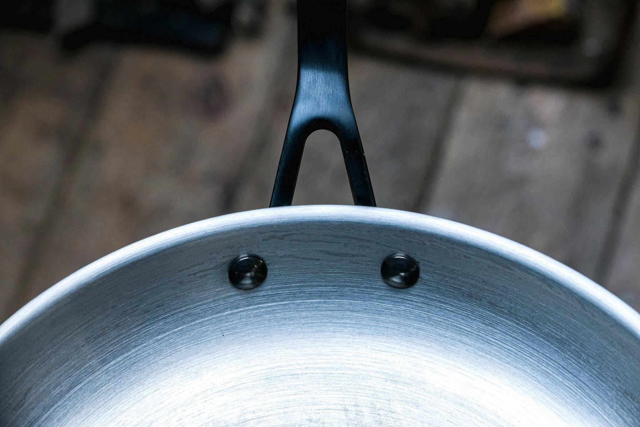 The KitchenAid 5-Ply Clad Stainless Steel Induction Frying Pan, 12.25-Inch, Polished Stainless Steel.