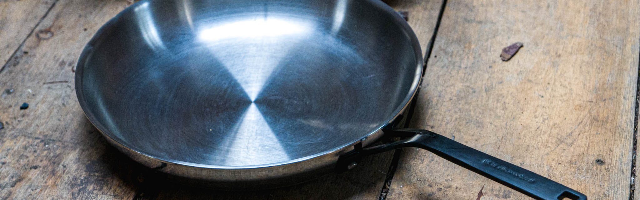 The KitchenAid 5-Ply Clad Stainless Steel Induction Frying Pan, 12.25-Inch, Polished Stainless Steel.