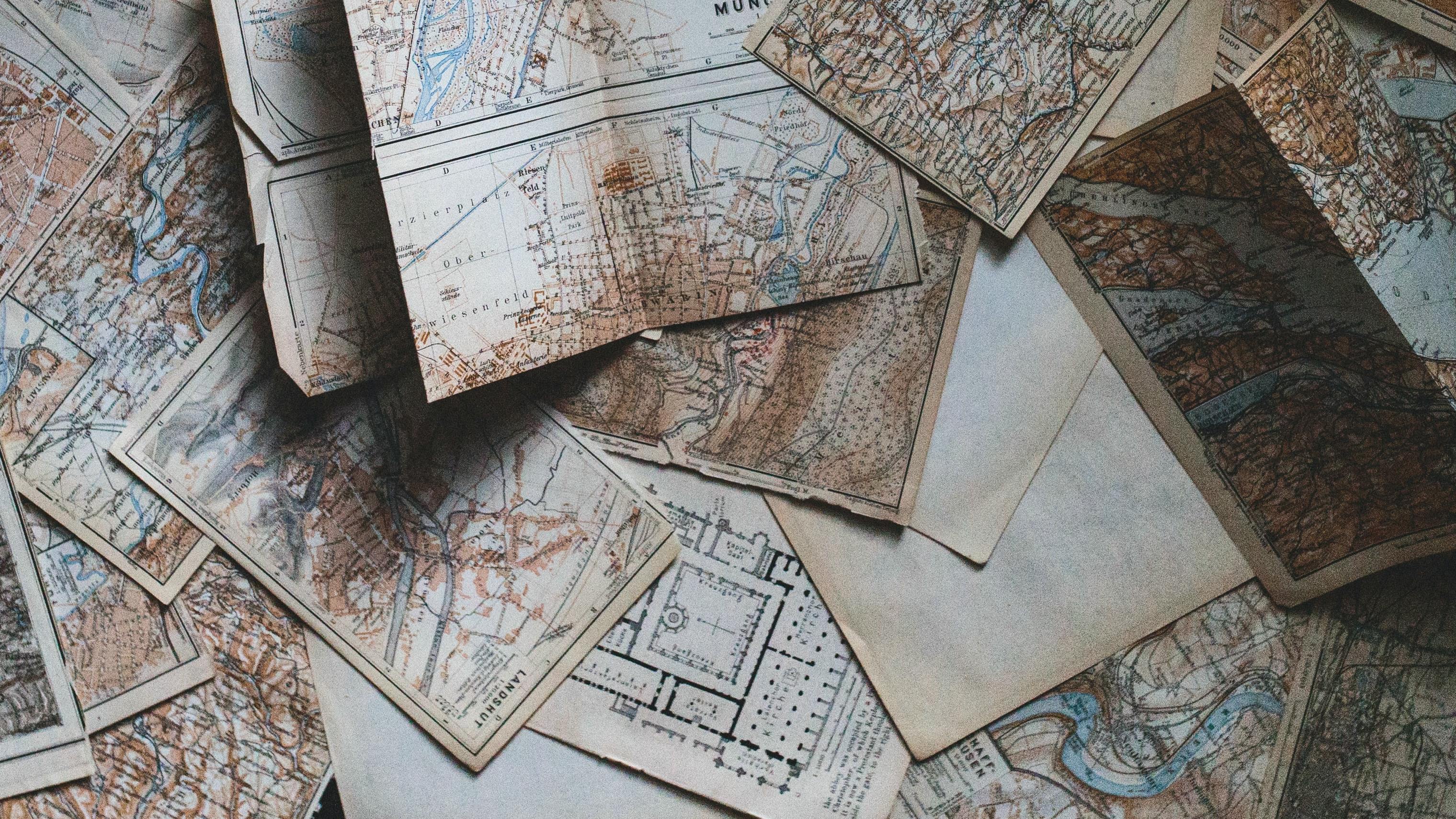 Maps scattered on a table