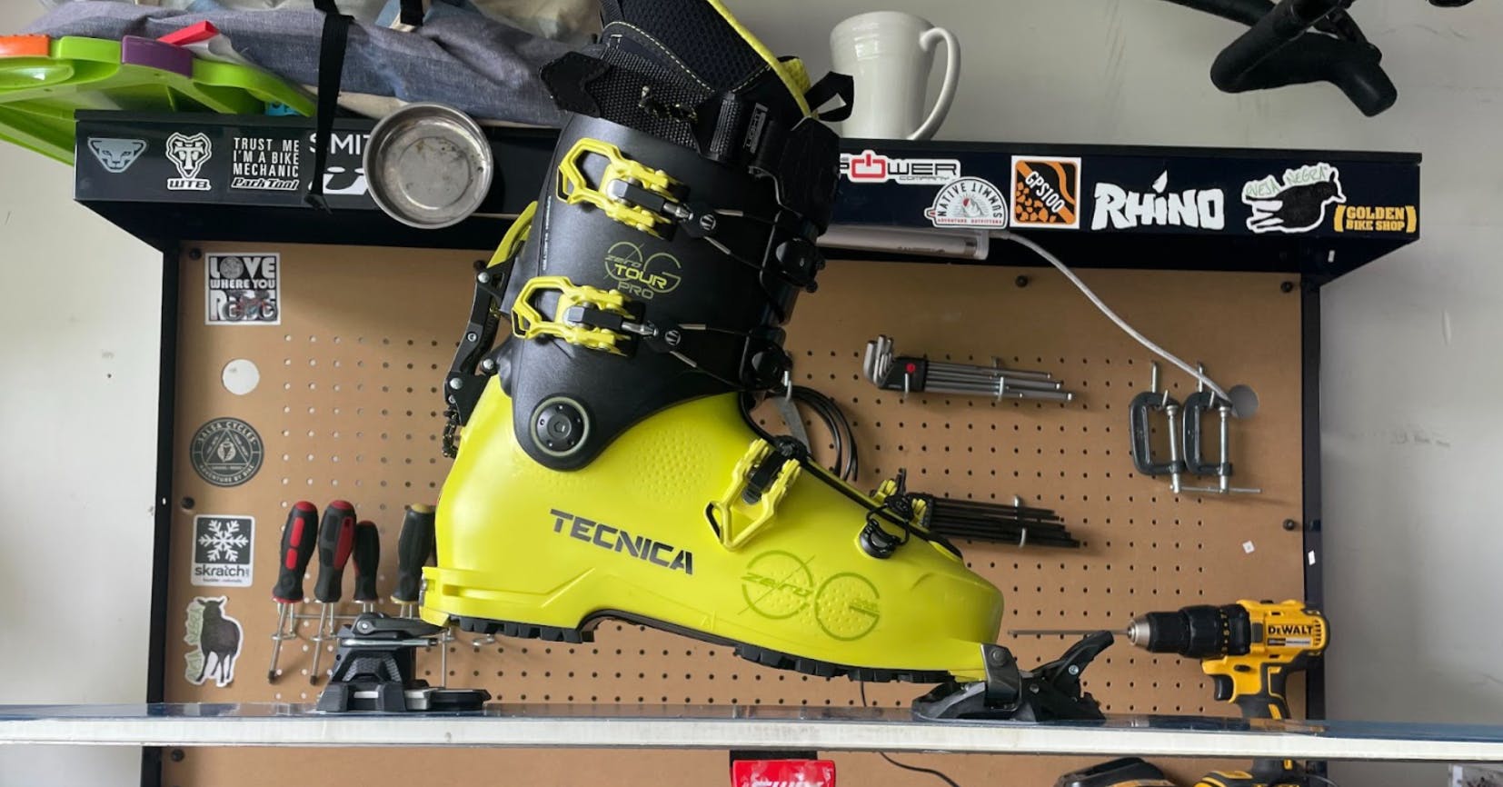 The Marker Alpinist 12 Ski Bindings on a ski with a boot attached. 