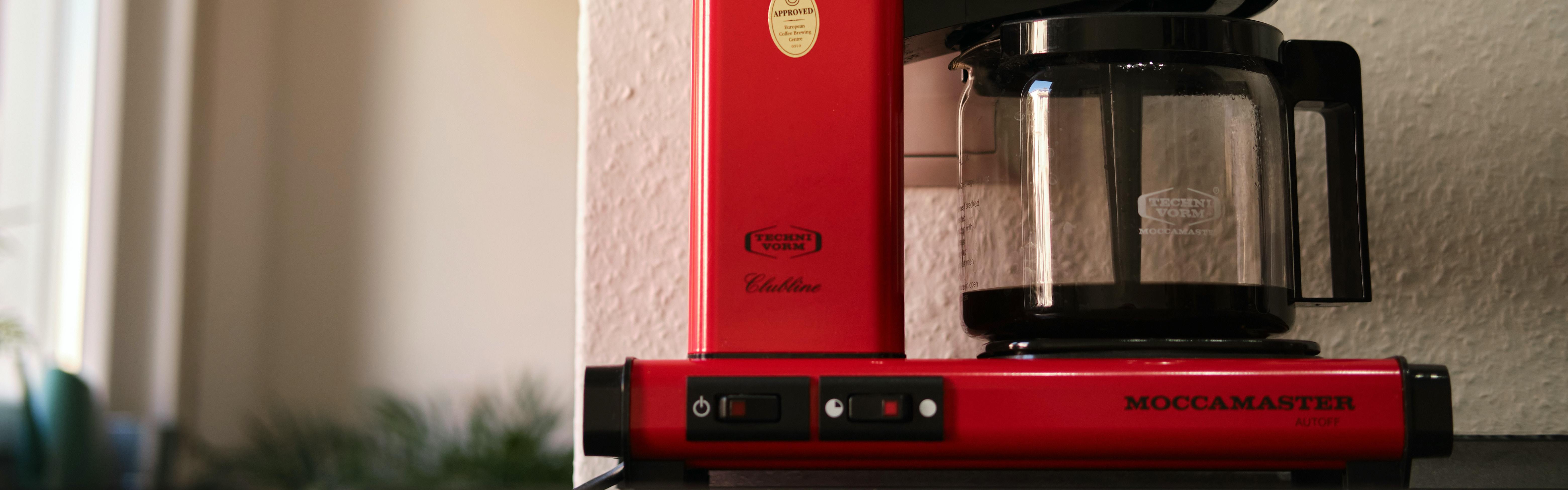 A Moccamaster coffee machine brews drip coffee.