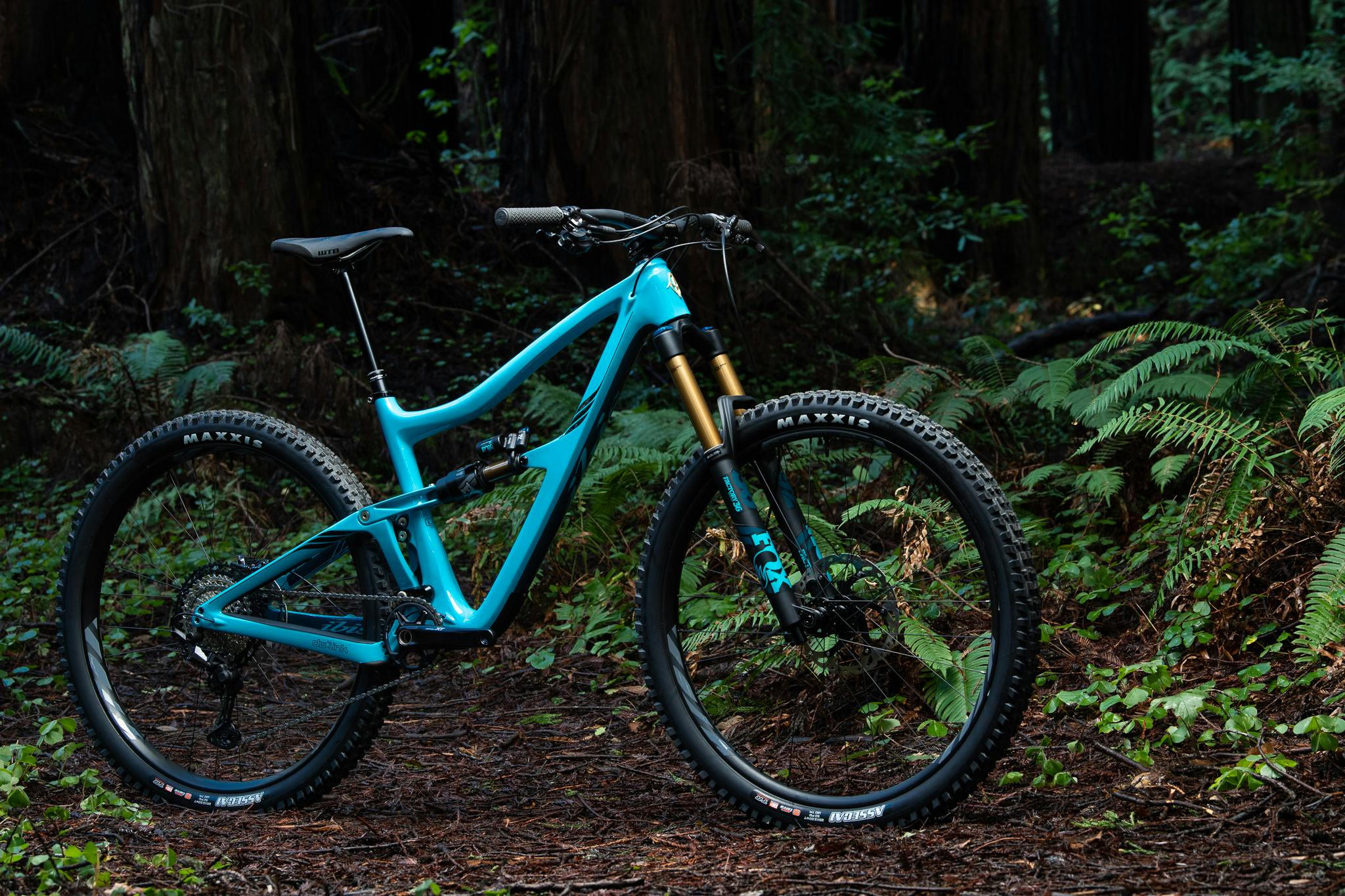 Ibis Cycles' Ripmo V2 mountain bike standing in the forest.