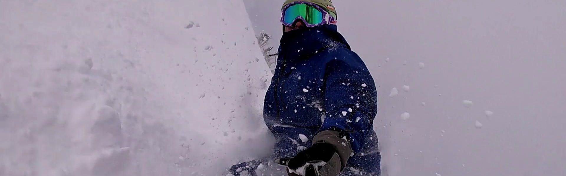 A snowboarder in deep snow. 