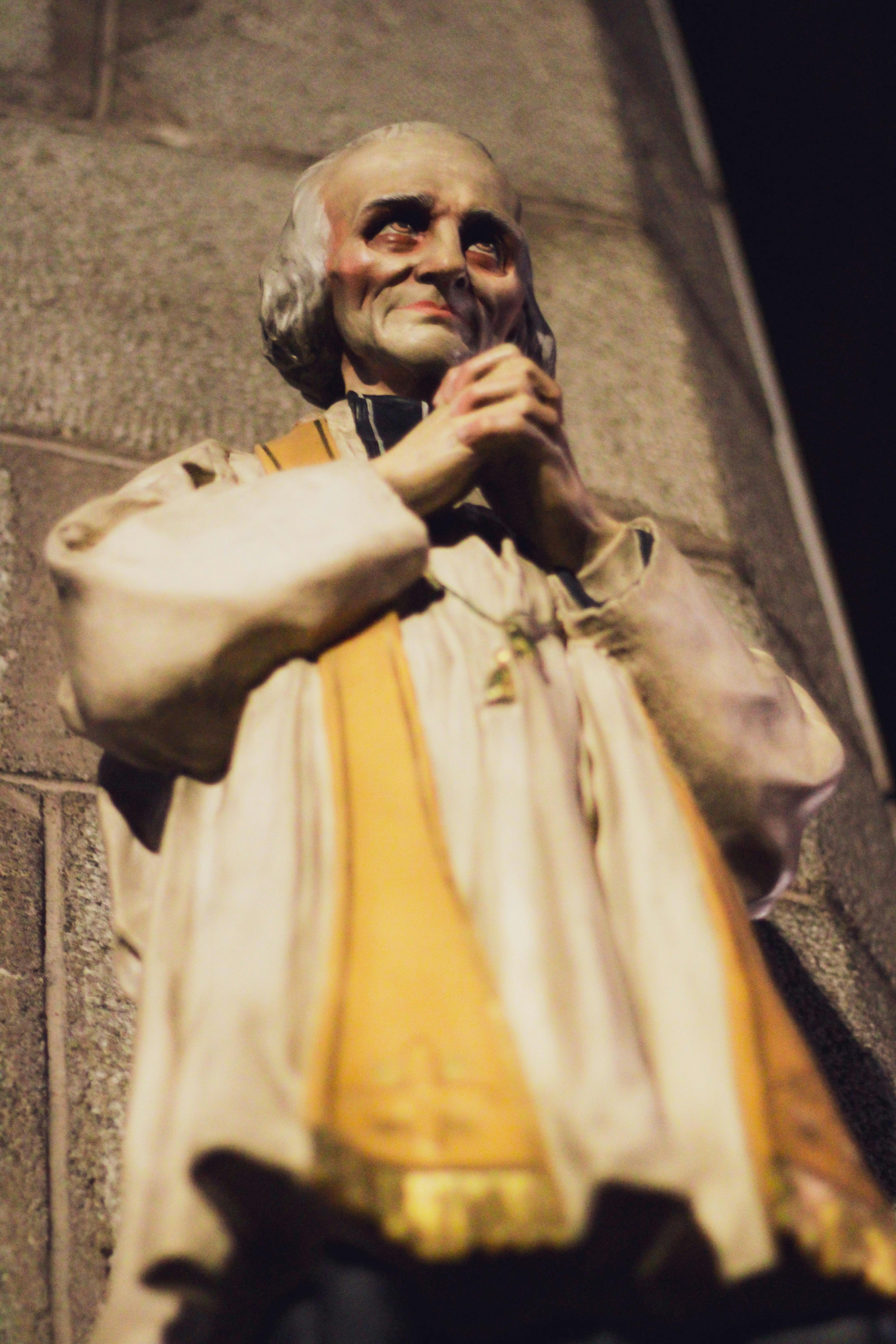 A statue of a priest