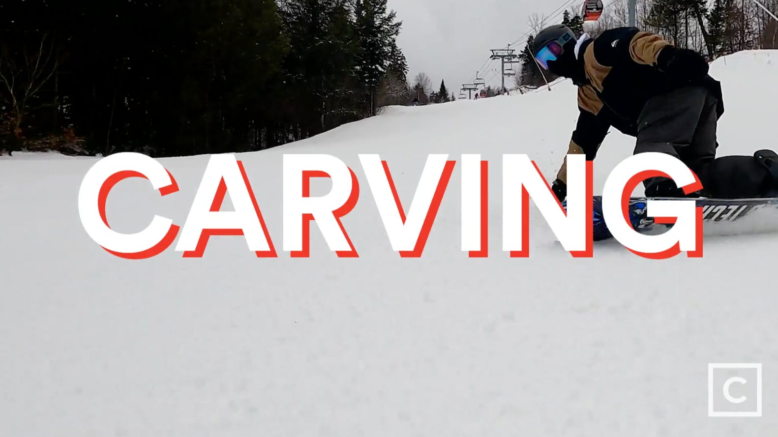 Curated expert Colby Henderson on the slope with a "Carving" graphic over the image