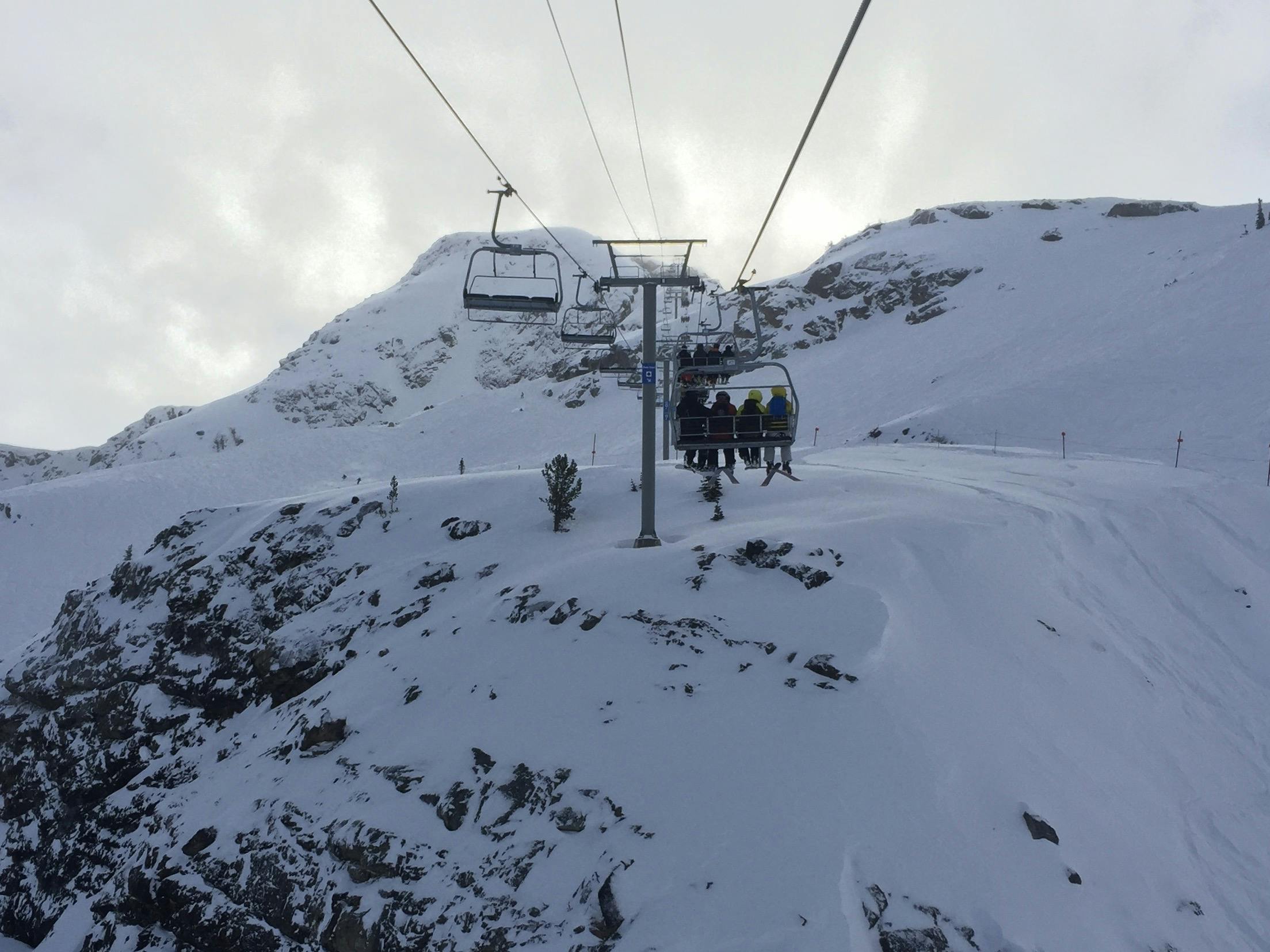 A chairlift on a snowy mountain.