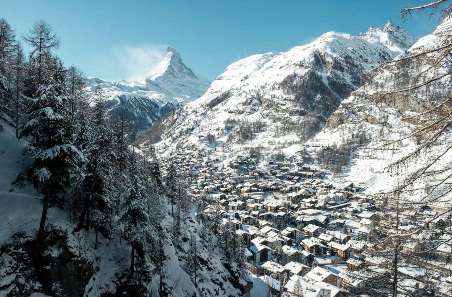 A snowy town with the Matterhorn in the background. 
