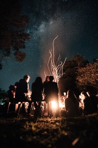 People gather around a campfire
