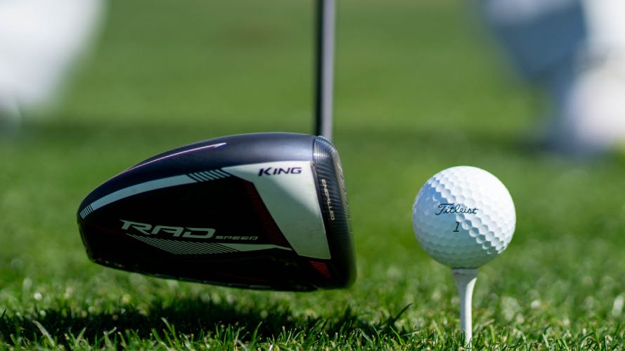 Image of a Cobra Radspeed driver about to hit a golf ball