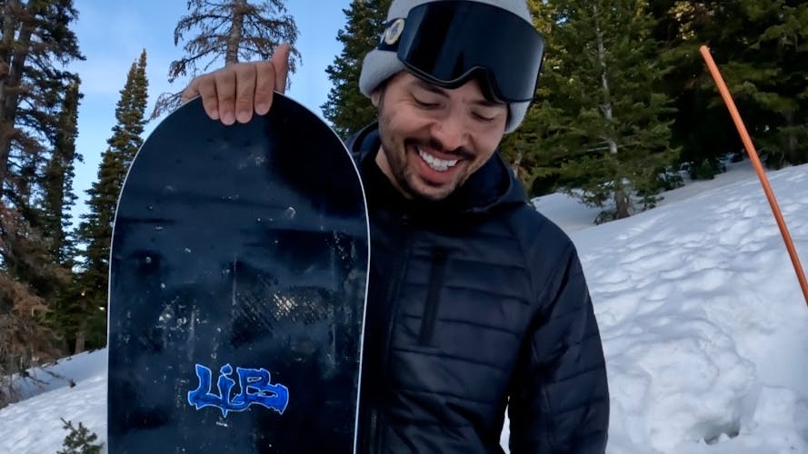 Snowboard Expert Yuri Czmola standing with the 2023 Lib Tech Skunk Ape snowboard