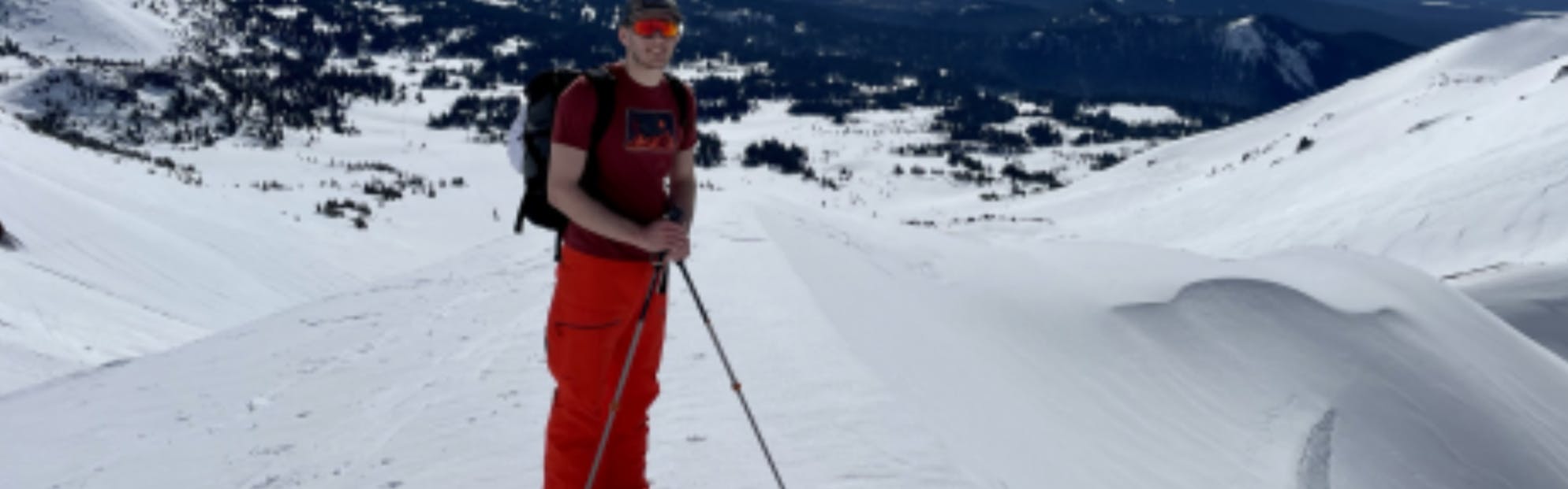 A skier standing in the Norrona Lofoten Men's Pants.
