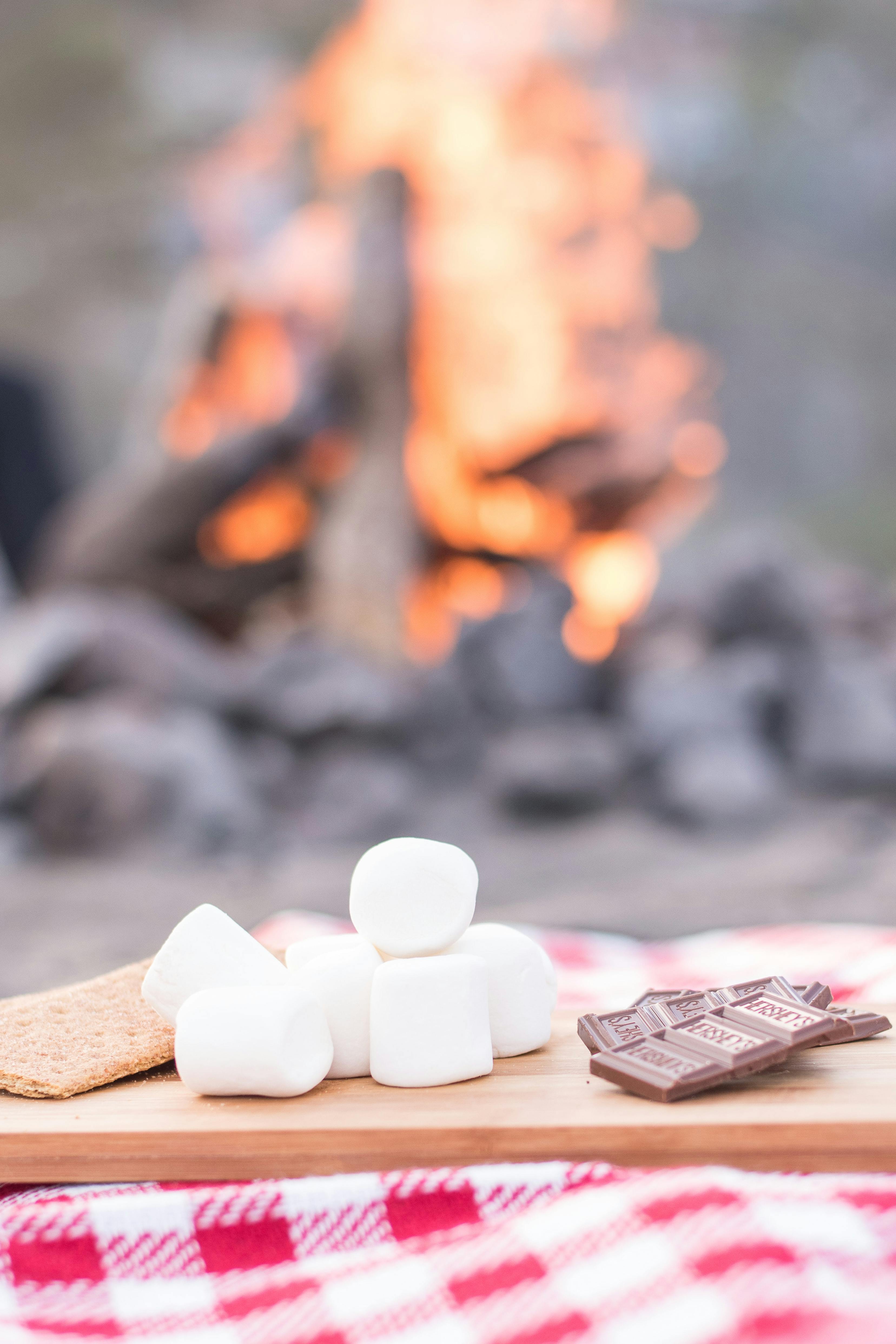 Smores sit on a cutting board.