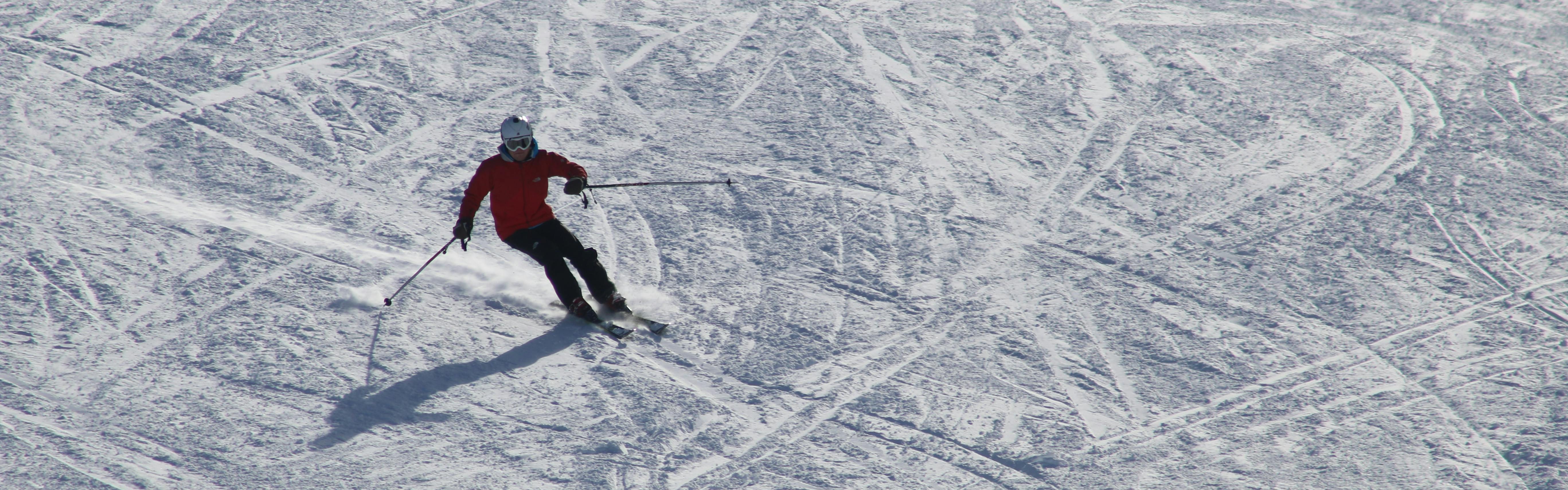A skier carves a turn