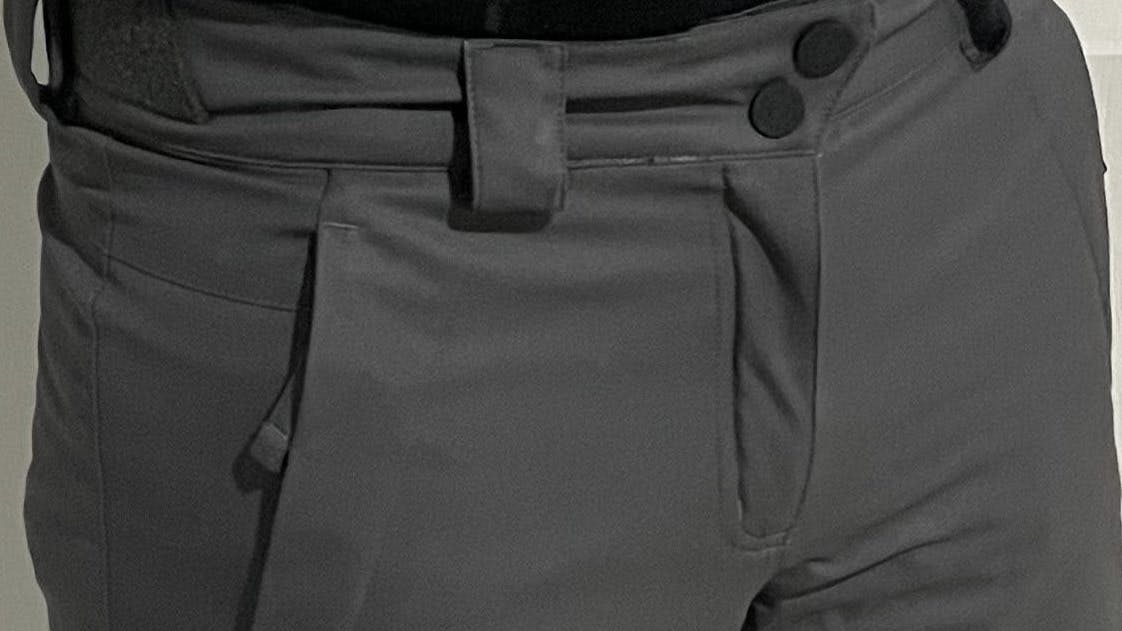 A man wearing the Obermeyer Men's Orion Pants. 