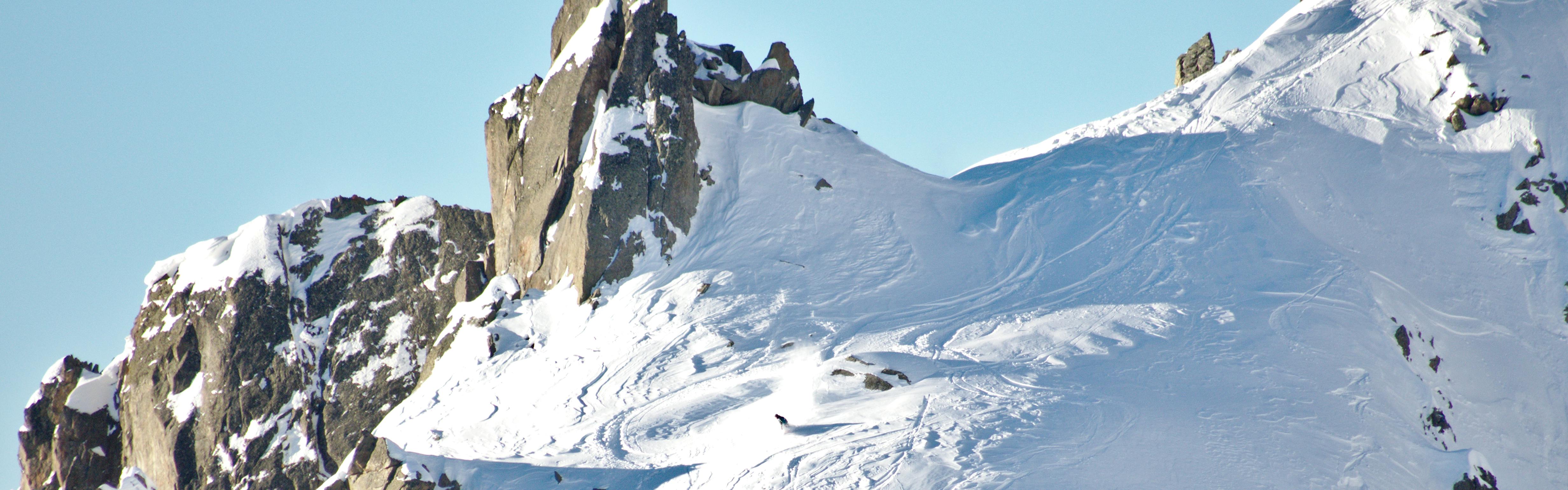 A skier skis at Chamonix in the 2014 Freeride World Tour on a bluebird day. 