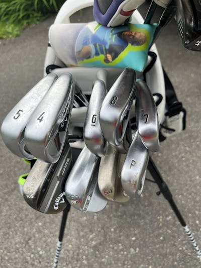 The Callaway Apex 2021 Irons in a golf bag.