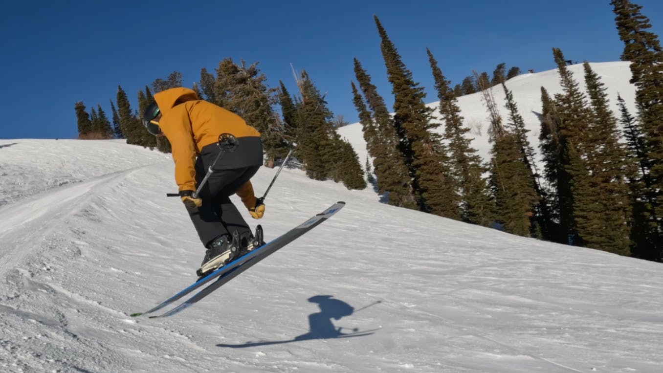 A skier doing a flip on the 2023 K2 Mindbender 108Ti Skis.