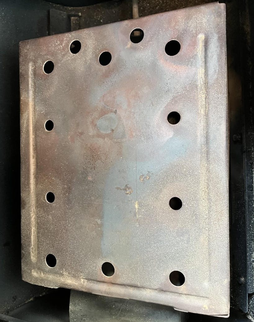The deflection plate from a pellet grill.
