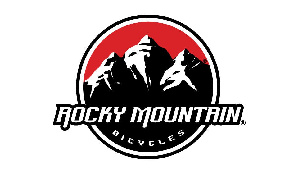The Rocky Mountain Bicycles logo reads "Rocky Mountain Bicycles" over an image of black and white mountains in front of a red sky.