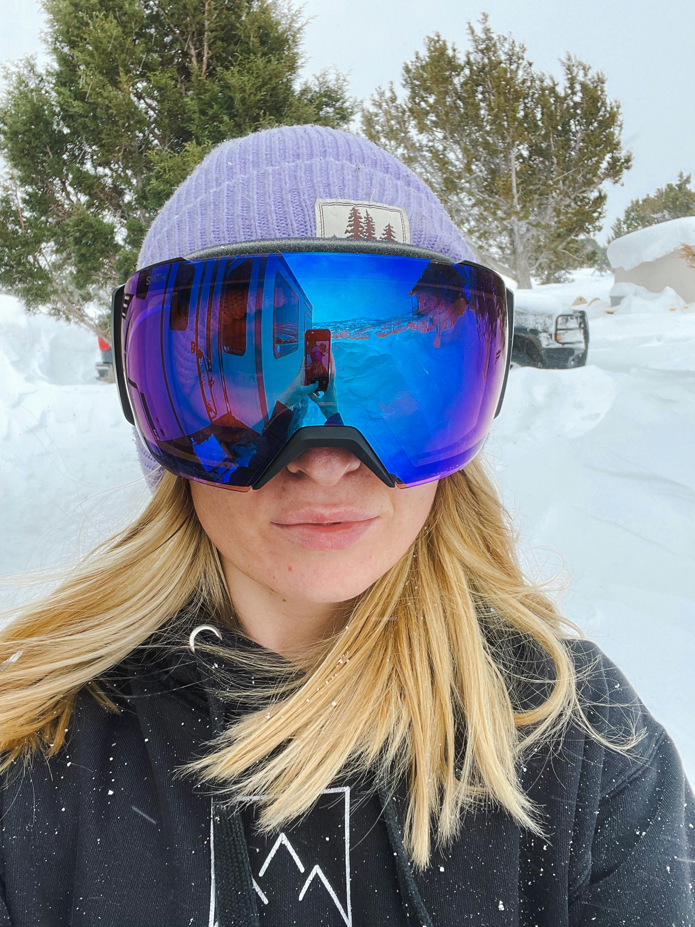 A skier wearing the Smith I/O MAG S Goggles · Women's · 2022. 