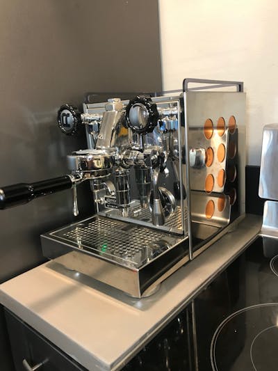 The Rocket Espresso Appartamento Espresso Machine sitting on a counter. 