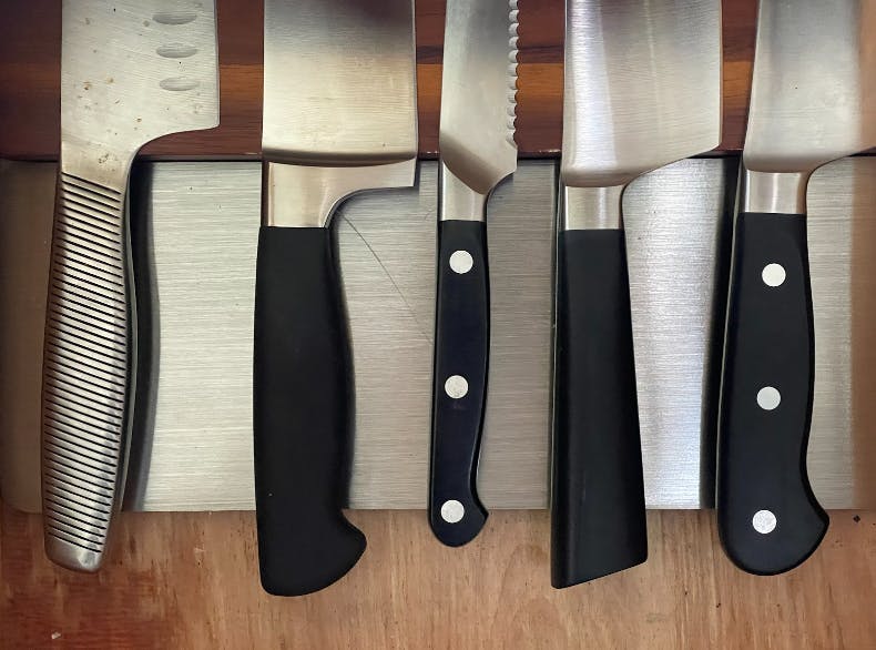 Knives on the Mercer Magnetic Knife Board.