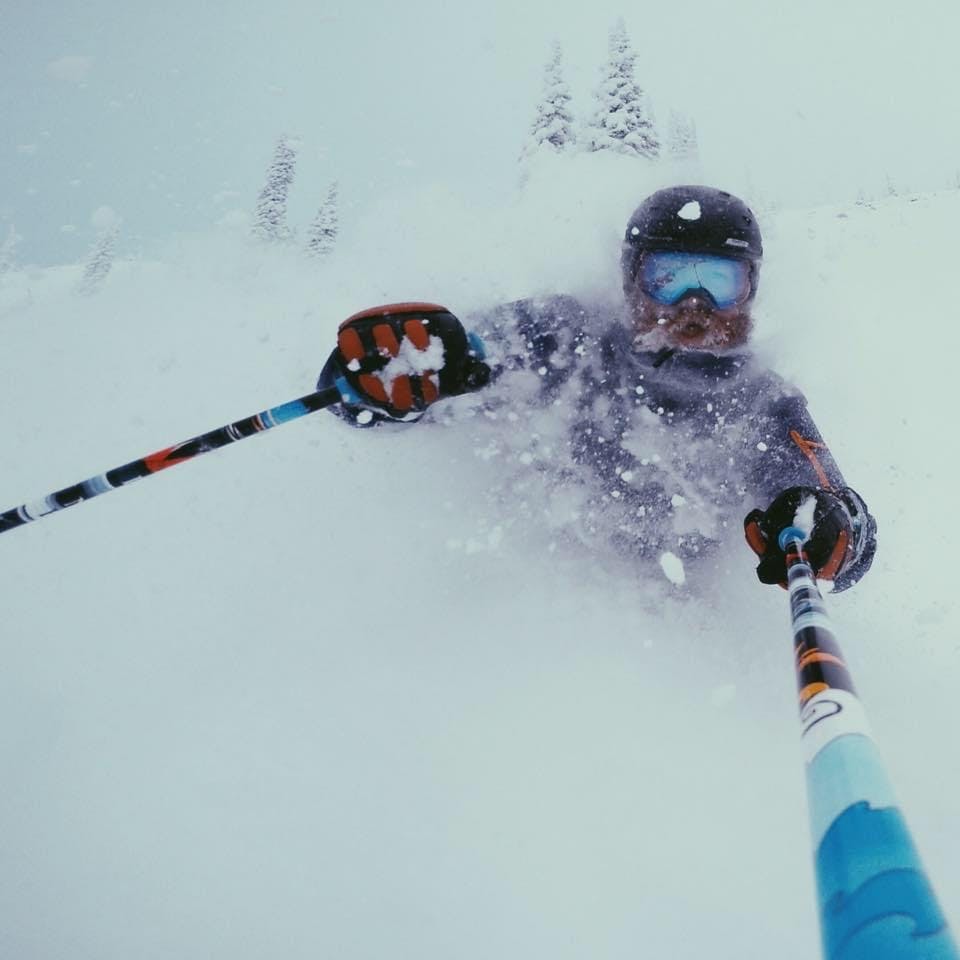 A selfie of a skier in deep powder. 