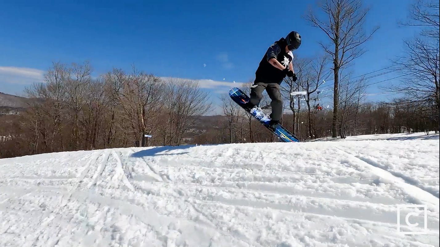 Curated expert Colby Henderson executing a jump turn with a Lib Tech Golden Orca snowboard