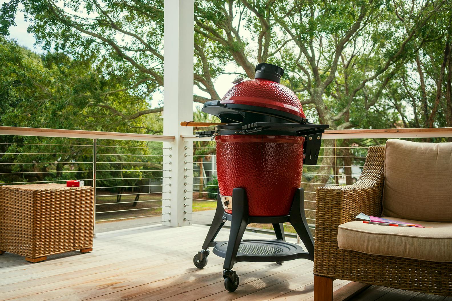 A Joe Kamado grill sits on a patio. 