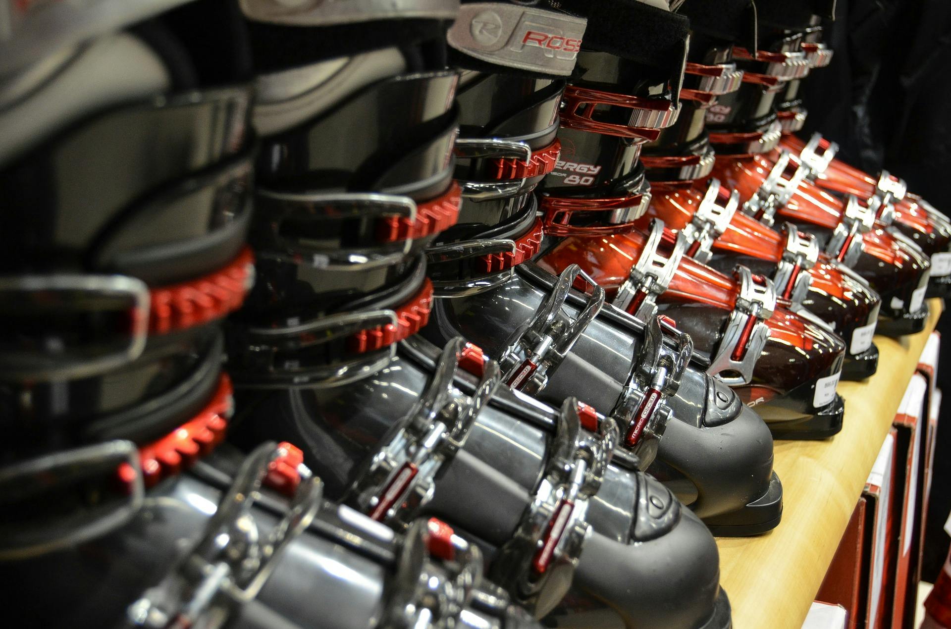 A line of ski boots in a store.
