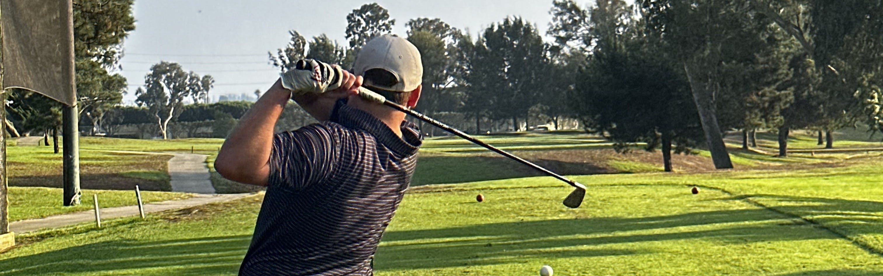 A man swinging with the  Titleist U505 Utility Iron.