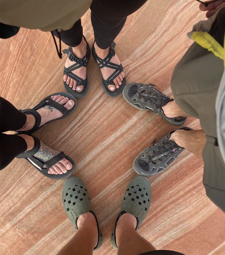 Four pairs of shoes together, The Chaco Z/Cloud 2 on top, the Teva Original on the left, and the Salomon Tech Amphib 4 on the right.