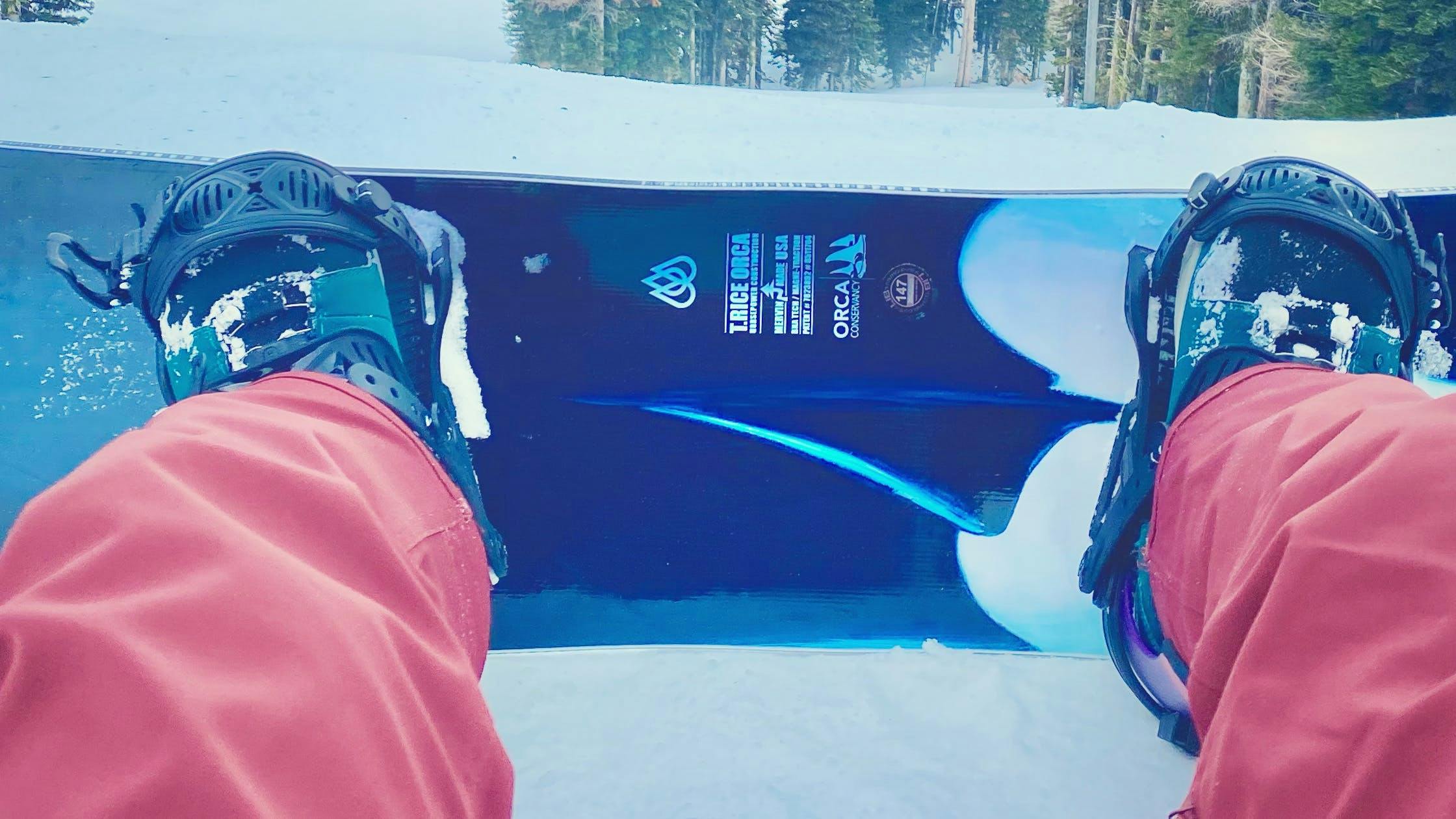 Top down view of the Lib tech Orca Snowboard on a mountain.