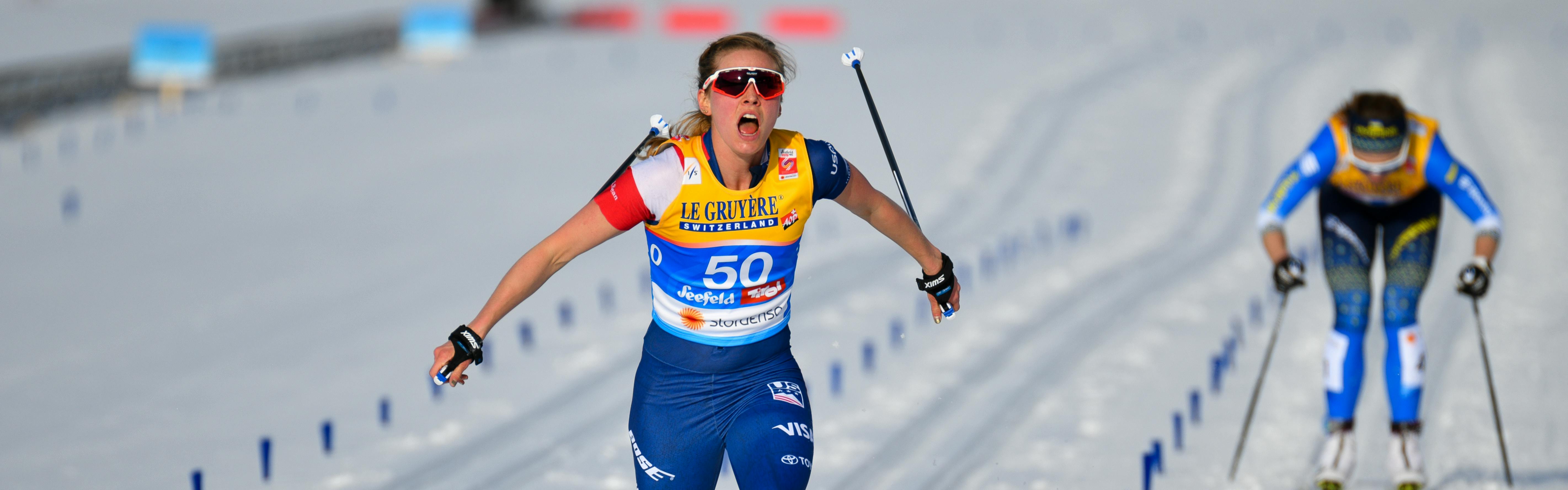 Jessie Diggins crosses the finish line at the 2019 Nordic World Ski Championships and shouts in celebration. 