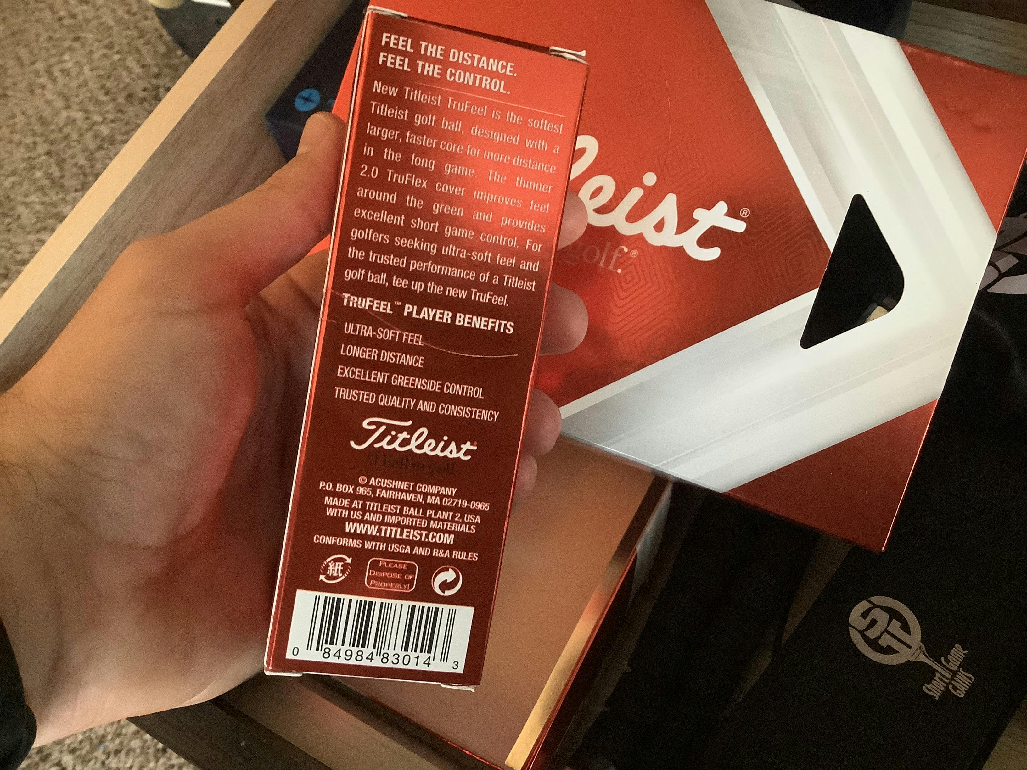 Back of the  Titleist TruFeel Golf Balls packaging. 
