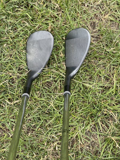 Two golf wedges.