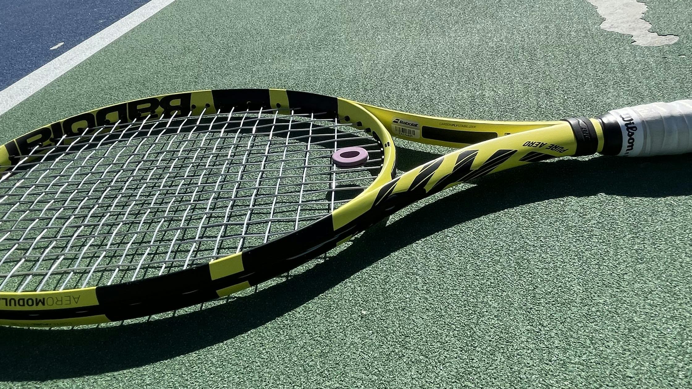 The Babolat Pure Aero 100 Racquet · Unstrung on a tennis racquet. 