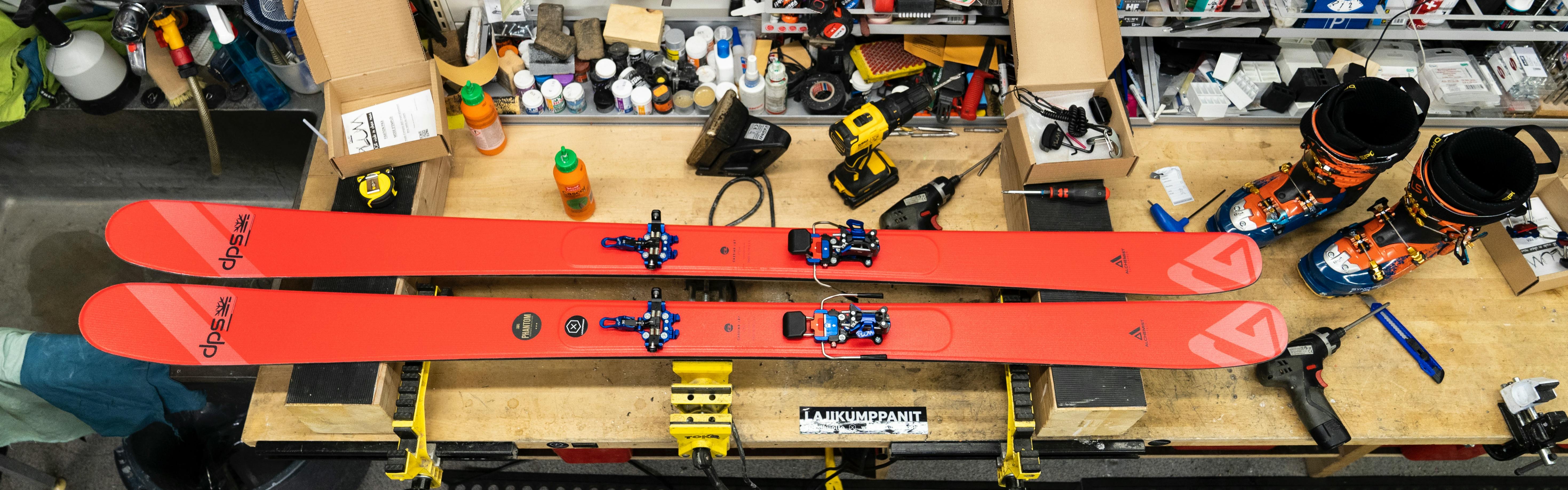 A pair of DPS Skis on a table. 