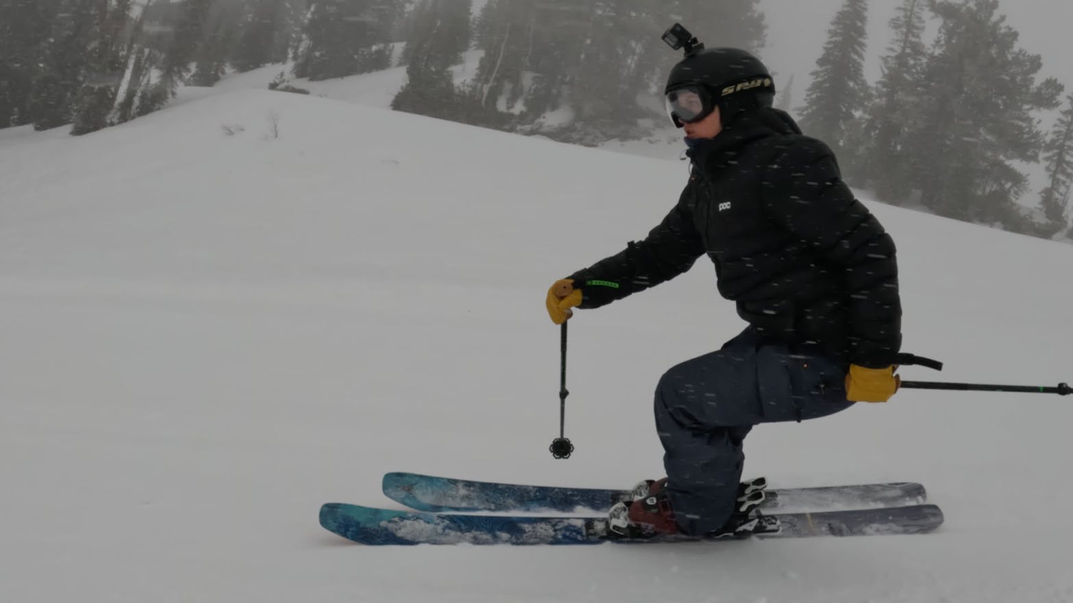 Curated Ski Expert Daryl Morrison on the 2023 Atomic Bent Chetler 100 skis on a groomed run in foggy conditions