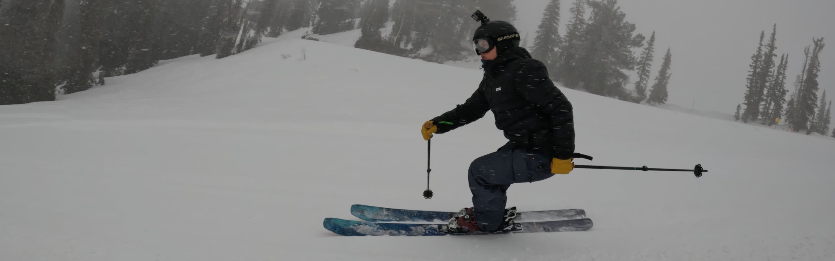 Curated Ski Expert Daryl Morrison on the 2023 Atomic Bent Chetler 100 skis on a groomed run in foggy conditions