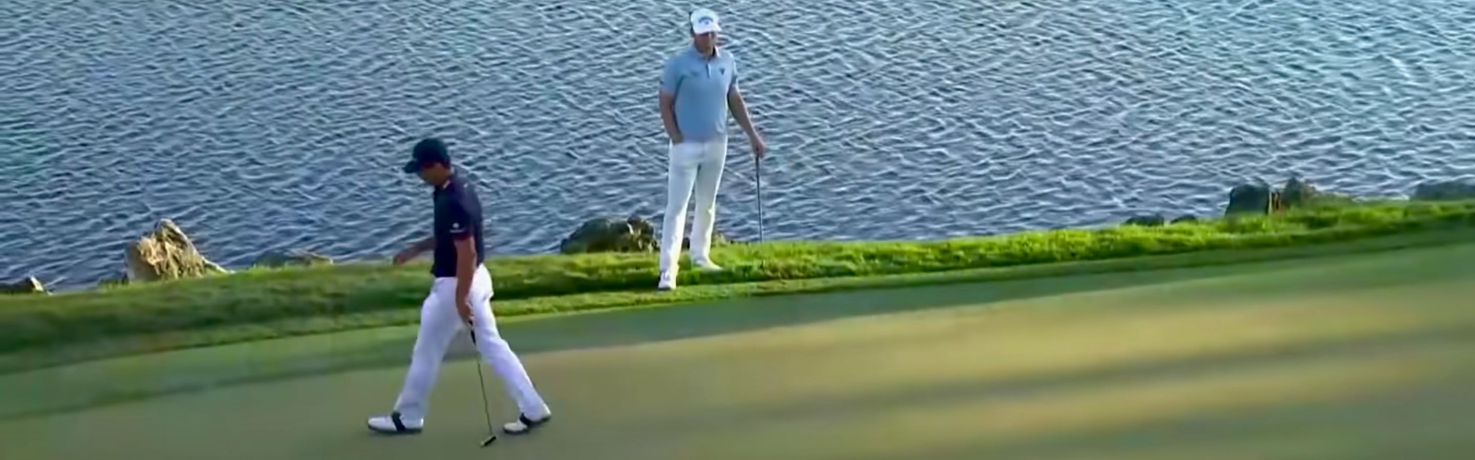 A screenshot from the Arnold Palmer Invitational tournament with two golfers walking next to a water feature. 