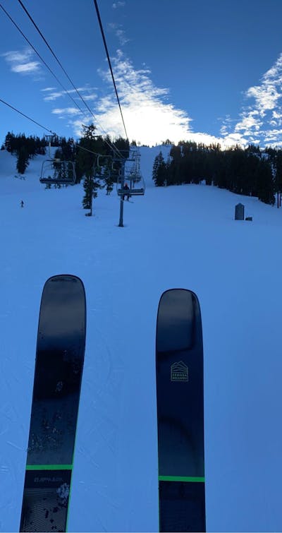 Top down view of the Armada Declivity 92 TI Skis on a ski lift. 