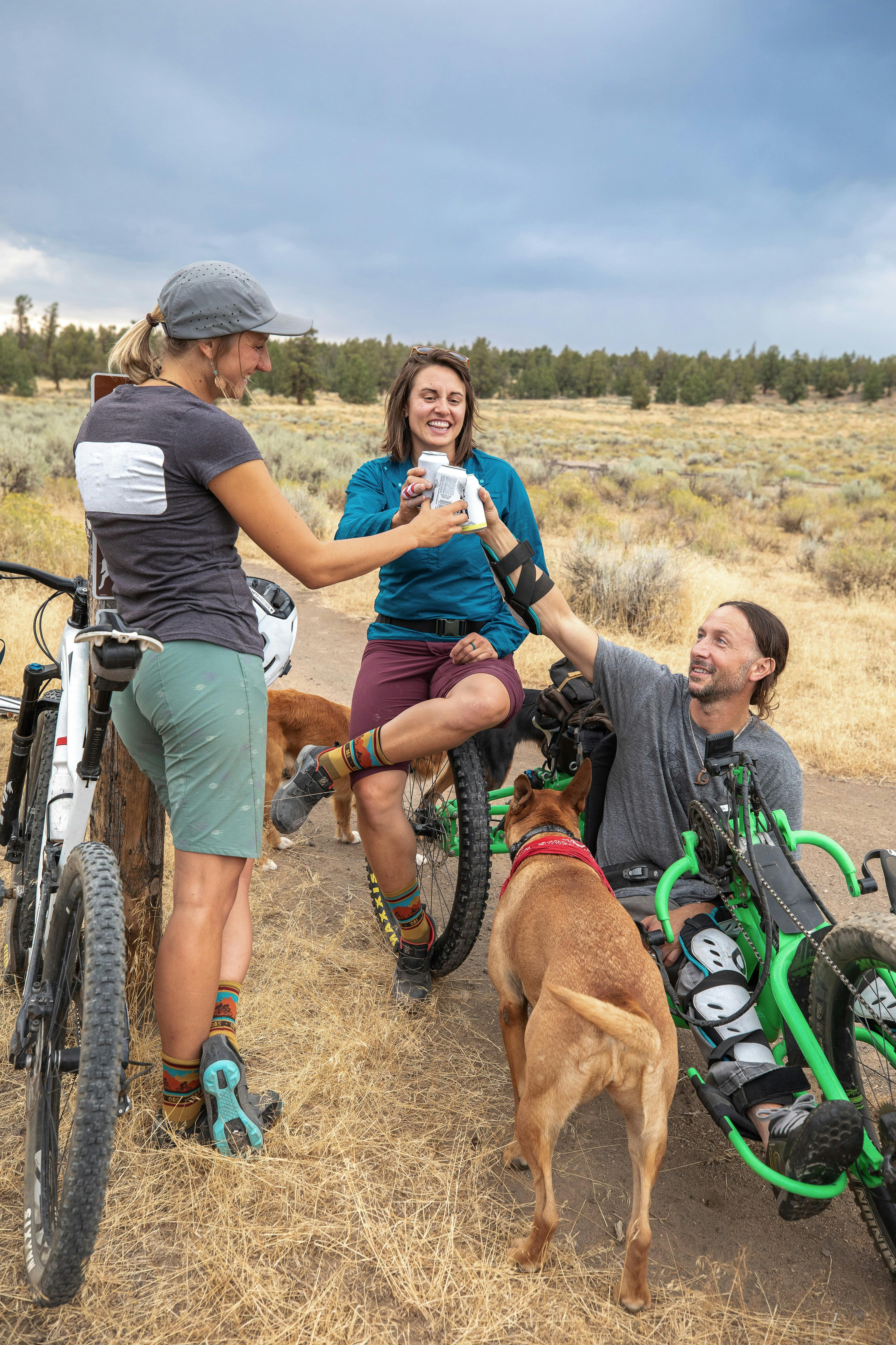 People share a drink after a long ride 