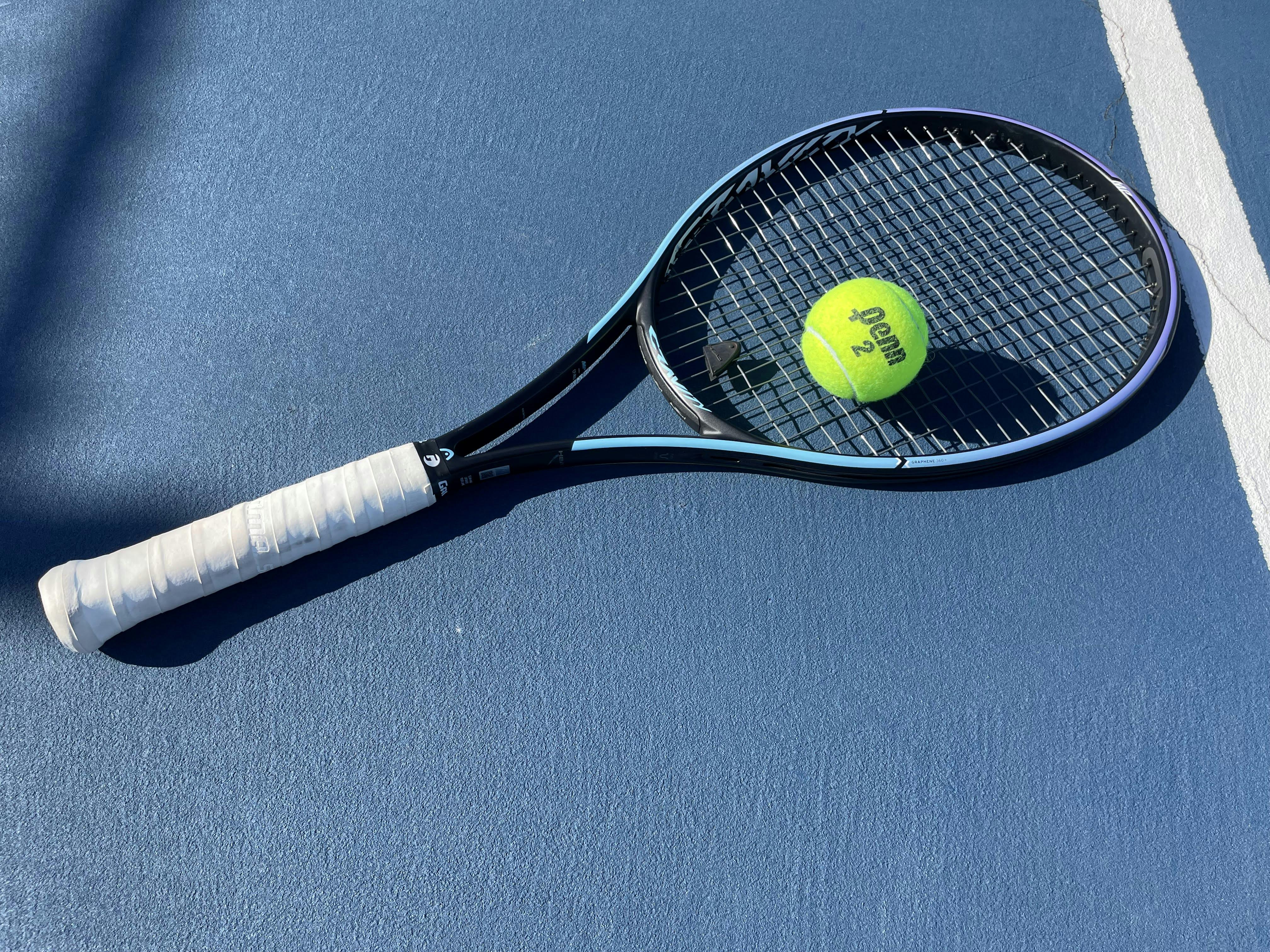 The Head Gravity MP Racquet in the color teal.
